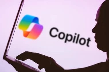 Microsoft 365 Copilot AI tools, Researcher and Analyst, displayed on a laptop screen, assisting with deep research and data analysis